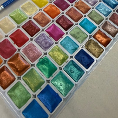 A large pearl watercolour set, rows of shimmering metallic pans
